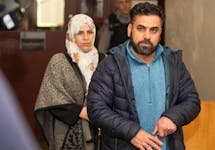 Maher Al Marrach, right, and Basima Al Jaji leave Halifax youth court Monday after appearances by four teenagers charged with second-degree murder in the April 22 stabbing death of their son Ahmad Maher Al Marrach, 16.