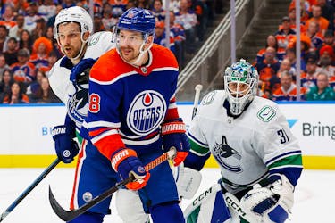 May 12, 2024; Edmonton, Alberta, CAN; Edmonton Oilers forward Zach Hyman (18) tries to screen Vancouver Canucks goaltender Arturs Silovs (31) during the third period in game three of the second round of the 2024 Stanley Cup Playoffs at Rogers Place. Mandatory Credit: Perry Nelson-USA TODAY Sports