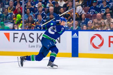 May 8, 2024; Vancouver, British Columbia, CAN; Vancouver Canucks defenseman Nikita Zadorov (91) scores on this shot against the Edmonton Oilers during the third period in game one of the second round of the 2024 Stanley Cup Playoffs at Rogers Arena. Mandatory Credit: Bob Frid-USA TODAY Sports
