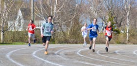 A closely contested boys' 400-metre dash on Monday at Atlantic Street field saw, from the left, Kenzie Neville, Whitney Pier; Jake MacNeil, Breton Education Centre; Finn Courage, Cabot Education Centre; Jack Viva, Dr. T.L. Sullivan; and Jackson MacLellan, Malcolm Munroe in competition.