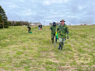 Members of the Construction Engineering Flight in Pictou helped plant trees along with other volunteers on Saturday at a property in Merigomish.