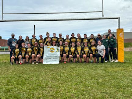 The host Three Oaks Axewomen won the girls’ championship banner at the 28th David Voye Memorial rugby tournament in Summerside on May 11. Members of the Axewomen are, front row, from left: Jaida Clow, Peyton Maund, Katie-Grace Noye, Kailyn Gallant, Ava Pomeroy, Nina Kenny, Sophie McKenna, Marleigh-Jane Smallwood, Alexa McCarthy, Anna Gallant, Hudsyn Somers, Tayler Warren, Madison Brown and Bella MacKinnon. Back row: Brent Woodside, Bree McAlduff, Ava Allain, Deirdre Studer, Nya Martin, Brooke McGuigan, Tori Atkinson, Carley Blanchard, Kenna Warnell, Chloe Campbell, Finley Blacquiere, Emma Cerisano, Kennedy Clow, Kaycee Rennie, Dru Gillis, Elly Smallwood and Tim Hockin. Photo Courtesy of Joel Arsenault • Special to The Guardian