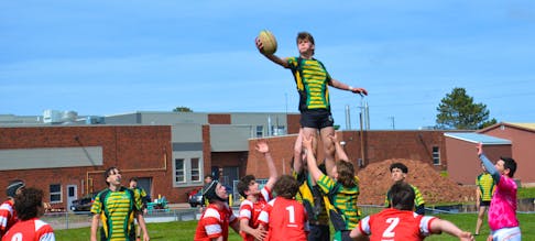 The Three Oaks Axemen’s Max Clark grabs the ball on a line-out during action against the Charlottetown Rural Raiders on May 10 during the 28th David Voye Memorial rugby tournament in Summerside. Three Oaks won the senior AAA boys’ championship banner. Jason Simmonds • The Guardian
