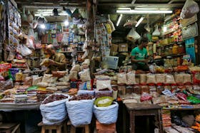 Vendors wait for customers at their respective shops at a retail market in Kolkata, India, December 12, 2018.