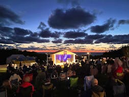 Since 2021 the Sunset Series has presented more than a dozen concerts featuring some of the Canada’s finest musical talent in the outdoor space at the Inverness County Centre for the Arts—a beautiful venue offering stunning ocean and sunset view that inspired the series name.