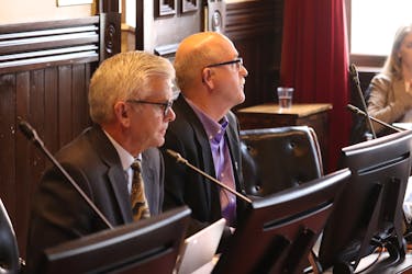 Coun. John McAleer, chair of the finance committee, and Coun. Terry Bernard listen to debate at a recent Charlottetown council meeting. Bernard says the city should get more from taxes that the province collects during large events like the Jack Frost Festival or ECMA awards. - Logan MacLean