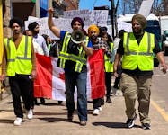 Foreign workers lead a march down Grafton Street in downtown Charlottetown with more than 200 people holding signs protesting the recent changes to P.E.I.'s immigration policy.  Carolyn Drake • The Guardian