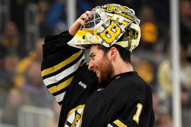 May 12, 2024; Boston, Massachusetts, USA; Boston Bruins goaltender Jeremy Swayman (1) slips on his mask during the second period in game four of the second round of the 2024 Stanley Cup Playoffs against the Florida Panthers at TD Garden. Mandatory Credit: Bob DeChiara-USA TODAY Sports
