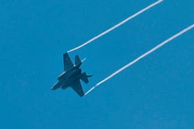 An Israeli combat aircraft is seen flying over Jerusalem on Israel's Memorial Day, when the country commemorates fallen soldiers of Israel's wars and Israeli victims of hostile attacks, amid the ongoing conflict in Gaza between Israel and the Palestinian Islamist group Hamas, May 13, 2024.