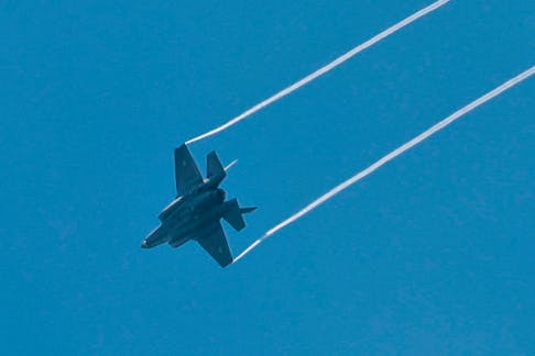 An Israeli combat aircraft is seen flying over Jerusalem on Israel's Memorial Day, when the country commemorates fallen soldiers of Israel's wars and Israeli victims of hostile attacks, amid the ongoing conflict in Gaza between Israel and the Palestinian Islamist group Hamas, May 13, 2024.