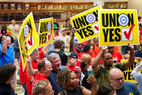 People react as the result of a vote comes in favour of the hourly factory workers at Volkswagen's assembly plant to join the United Auto Workers (UAW) union, at a watch party in Chattanooga, Tennessee, U.S., April 19, 2024. 