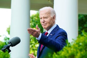 U.S. President Joe Biden acknowledges White House executive chef Cristeta Comerford, at a reception celebrating Asian American, Native Hawaiian, and Pacific Islander Heritage Month, in the Rose Garden of the White House, in Washington, U.S., May 13, 2024.