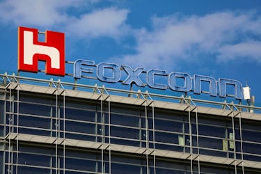 The logo of Foxconn, the trading name of Hon Hai Precision Industry, is seen on top of the company's building in Taipei, Taiwan March 30, 2018.