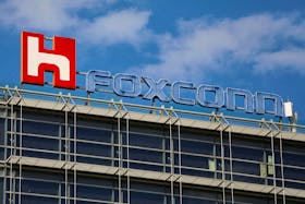 The logo of Foxconn, the trading name of Hon Hai Precision Industry, is seen on top of the company's building in Taipei, Taiwan March 30, 2018.