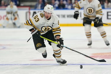 Apr 24, 2024; Toronto, Ontario, CAN; Boston Bruins forward Brad Marchand (63) carries the puck against the Toronto Maple Leafs during the second period of game three of the first round of the 2024 Stanley Cup Playoffs at Scotiabank Arena. Mandatory Credit: John E. Sokolowski-USA TODAY Sports