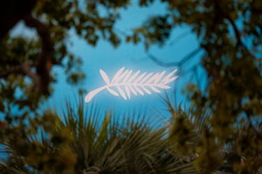 A Palme d'Or symbol is surrounded by trees before the opening ceremony of the 77th Cannes Film Festival in Cannes, France, May 14, 2024.