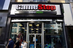 People walk by a GameStop in Manhattan, New York, U.S., December 7, 2021.