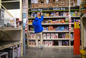 A shopper reaches for pesticide products at a Home Depot store in Wilmington, Delaware U.S. November 19, 2020.