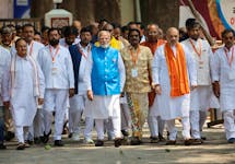 India's Prime Minister Narendra Modi walks with his party leaders on the day he files his nomination papers for the general elections in Varanasi, India May 14, 2024.