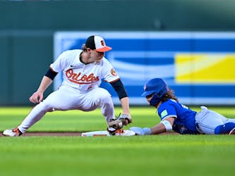 Bo Bichette of the Blue Jays steals second ahead of the tag of Gunnar Henderson of the Baltimore Orioles at Oriole Park at Camden Yards on May 13, 2024.