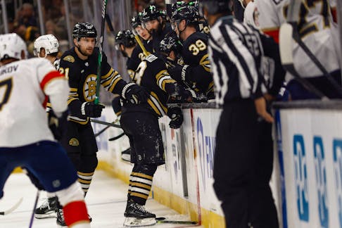 Boston Bruins captain Brad Marchand (63) struggles to get to the bench after being hit by Florida Panthers forward Sam Bennett during the first period of Game 3 of the second round of the 2024 Stanley Cup Playoffs at TD Garden in Boston. - Winslow Townson-USA TODAY Sports
