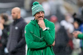 Dec 3, 2023; East Rutherford, New Jersey, USA; New York Jets quarterback Aaron Rodgers (8) watches warm ups before a game against the Atlanta Falcons at MetLife Stadium. Mandatory Credit: Brad Penner-USA TODAY Sports