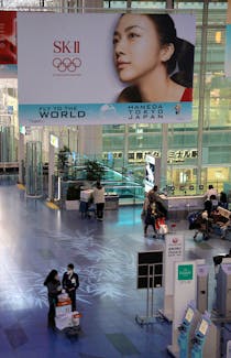 A banner advertising SK-II, owned by Procter & Gamble (P&G), an Olympic Games partner, is pictured at Haneda Airport in Tokyo, Japan, March 4, 2020. Picture taken on March 4, 2020.