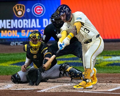 May 13, 2024; Milwaukee, Wisconsin, USA; Milwaukee Brewers third base Joey Ortiz (3) hits a double during the second inning of their game against the Pittsburgh Pirates at American Family Field. Mandatory Credit: Mark Hoffman-USA TODAY Sports