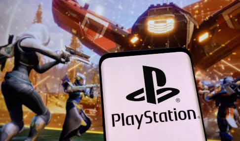 PlayStation logo is seen on a smartphone in front of Destiny game displayed in this picture illustration, February 1, 2022.