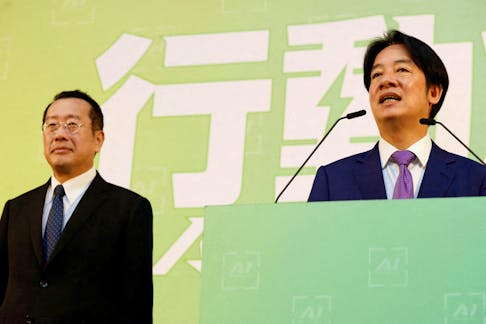 Taiwan President-elect Lai Ching-te speaks as Incoming Defence Minister Wellington Koo stands next to him during a press conference where incoming cabinet members are announced, in Taipei, Taiwan April 25, 2024.