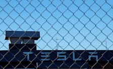 A Tesla sign is displayed over a Tesla showroom in Malmo, Sweden, December 14, 2023.