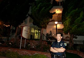 A policeman stands outside the apartment building where accused Boston crime boss James "Whitey" Bulger was arrested in Santa Monica, California June 22, 2011. On the run for 17 years, Bulger and his longtime girlfriend were finally caught in California by the Federal Bureau of Investigation on Wednesday.