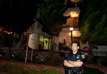 A policeman stands outside the apartment building where accused Boston crime boss James "Whitey" Bulger was arrested in Santa Monica, California June 22, 2011. On the run for 17 years, Bulger and his longtime girlfriend were finally caught in California by the Federal Bureau of Investigation on Wednesday.