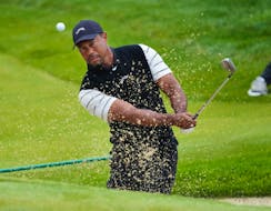May 14, 2024; Louisville, Kentucky, USA; Tiger Woods hits a bunker shot on the 3rd green during a practice round for the PGA Championship golf tournament at Valhalla Golf Club. Mandatory Credit: Sam Upshaw Jr.-USA TODAY Sports