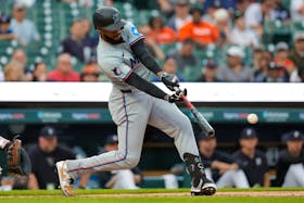 May 13, 2024; Detroit, Michigan, USA; Miami Marlins outfielder Bryan De La Cruz (14) hits an RBI single in the fifth inning against the Detroit Tigers at Comerica Park. Mandatory Credit: Rick Osentoski-USA TODAY Sports