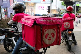 Foodpanda riders get ready for deliveries outside a restaurant, amid the coronavirus disease (COVID-19) outbreak in Kuala Lumpur, Malaysia July 8, 2020.