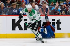 May 13, 2024; Denver, Colorado, USA; Dallas Stars center Matt Duchene (95) controls the puck as Colorado Avalanche left wing Zach Parise (9) falls to the ice in the third period in game four of the second round of the 2024 Stanley Cup Playoffs at Ball Arena. Mandatory Credit: Isaiah J. Downing-USA TODAY Sports