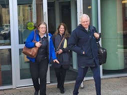 Mary Ann Holland, left, Michelle Morrison, centre, and lawyer Barry Morrison are seen leaving the Saint John Law Courts in April 2023. Holland's lawsuit against four Wolastoquey First Nations and their chiefs over eel harvesting survived a court ruling May 7.