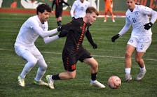 Jason Hartill of the Cape Breton Capers, centre, works his way past a pair of defenders during U Sports Men's Soccer Championship action at Ness Timmons Field in Sydney last November. The Capers will start their title defence at the end of August. JEREMY FRASER/CAPE BRETON POST