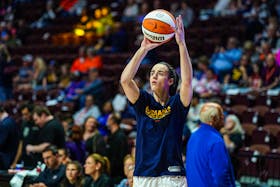May 14, 2024; Uncasville, Connecticut, USA; Indiana Fever guard Caitlin Clark (22) warms up before the start of the game against the Connecticut Sun at Mohegan Sun Arena. Mandatory Credit: David Butler II-USA TODAY Sports