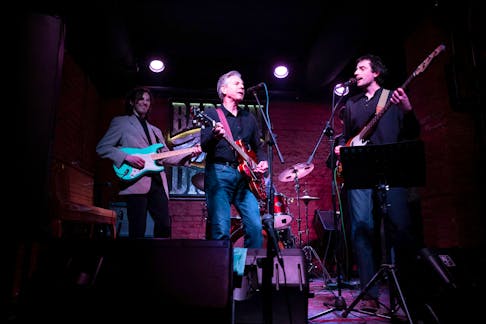 U.S. Secretary of State Antony Blinken performs "Rockin' in the Free World" with members of The 1999 band at the Barman Dictat bar as he visits Kyiv, Ukraine, on May 14, 2024. BRENDAN SMIALOWSKI/Pool via REUTERS