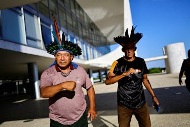 Brazilian Mura Indigenous people gesture after a meeting at the Planalto Palace in Brasilia, Brazil October 18, 2023.