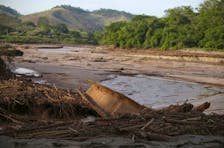 A boat is pictured in Rio Doce (Doce River) after a dam, owned by Vale SA and BHP Billiton Ltd burst, in Santa Cruz do Escalvado, Brazil, November 12, 2015. Picture taken November 12, 2015.