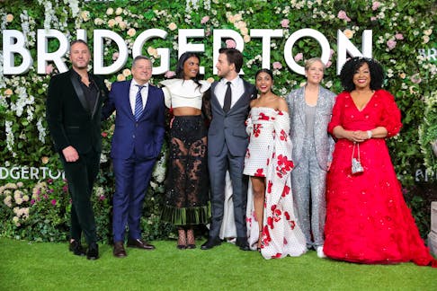 Executive Producer and Creator Chris Van Dusen, Netflix CEO Ted Sarandos, cast members Simone Ashley, Jonathan Bailey and Charithra Chandran, Executive Producers Betsy Beers and Shonda Rhimes attend the world premiere for the second season of the Netflix show "Bridgerton" in London, Britain March 22, 2022.