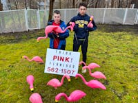 Sydney brothers Cailex, right, and Zaio Tournidis have their own pink flamingo business.  BARB SWEET/CAPE BRETON POST