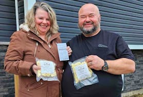 Angie Lodge-White, left, was the Cormack Cheese Co.’s first customer. The Cormack-based artisan cheese factory is owned by Melvin Rideout, right. – Contributed