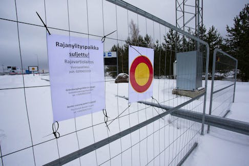 A notice is attached to a barrier at the closed Vaalimaa border check point between Finland and Russia in Virolahti, Finland, January 14, 2024. Lehtikuva/Lauri Heino/via