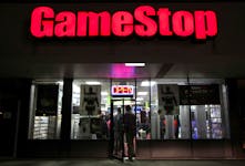 People enter a GameStop store during "Black Friday" sales in Carle Place, New York November 25, 2011.