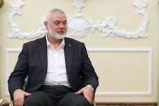 Palestinian group Hamas' top leader, Ismail Haniyeh meets with Iranian President Ebrahim Raisi (not pictured) in Tehran, Iran March 27, 2024. Iran's Presidency/WANA (West Asia News Agency)/Handout via