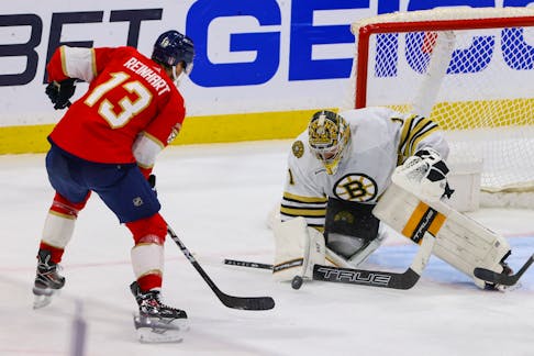 Boston Bruins goaltender Jeremy Swayman (1) makes a save against Florida Panthers centre Sam Reinhart (13) during the third period in game five of the second round of the 2024 Stanley Cup Playoffs at Amerant Bank Arena in Sunrise, Fla,. Tuesday, May 14, 2024. - Sam Navarro / USA TODAY Sports